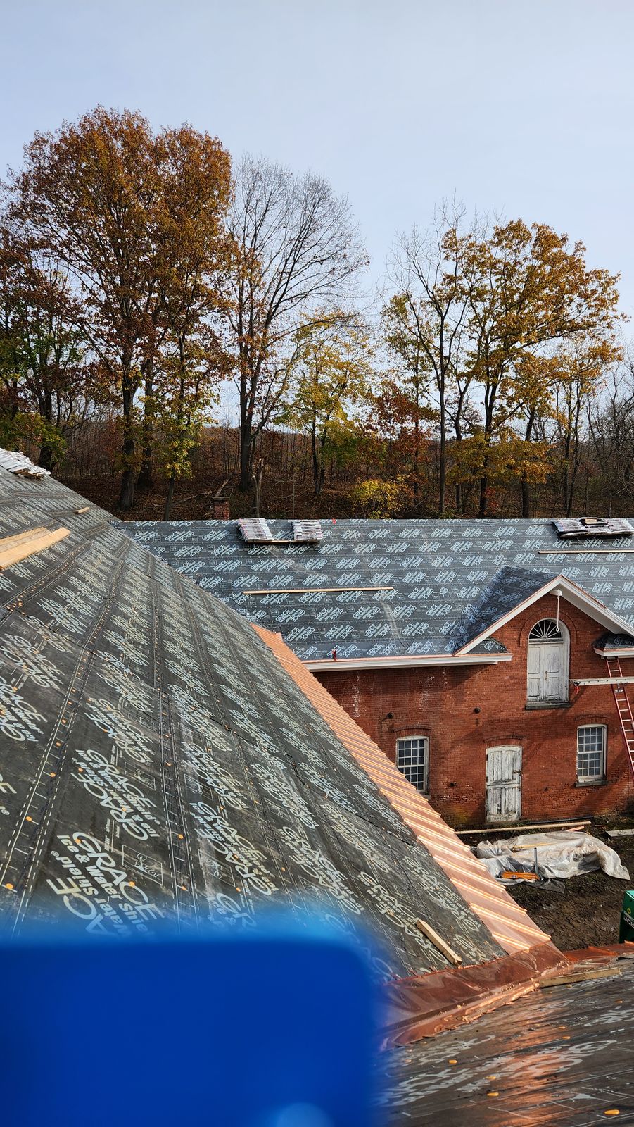 Copper snow slides installed over ice and water shield before the Camelot shingle field goes on