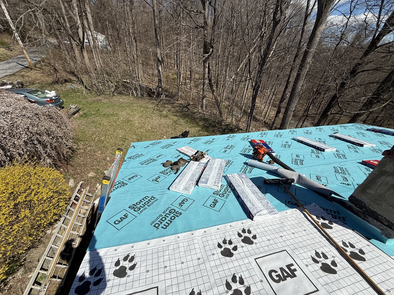 Leak barrier and synthetic underlayment on a roof deck before shingles