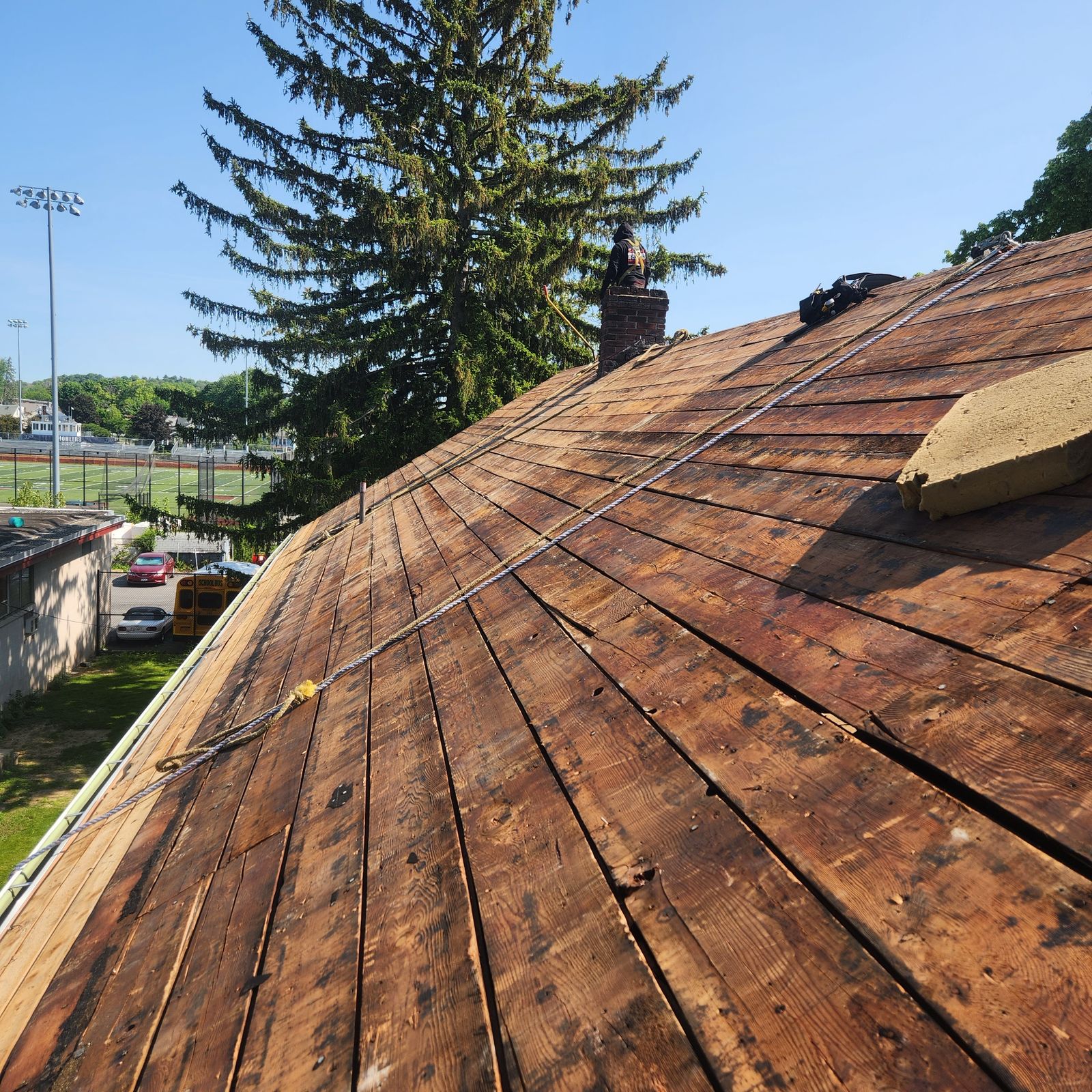 Original wide plank roof decking exposed after tear-off on an old building