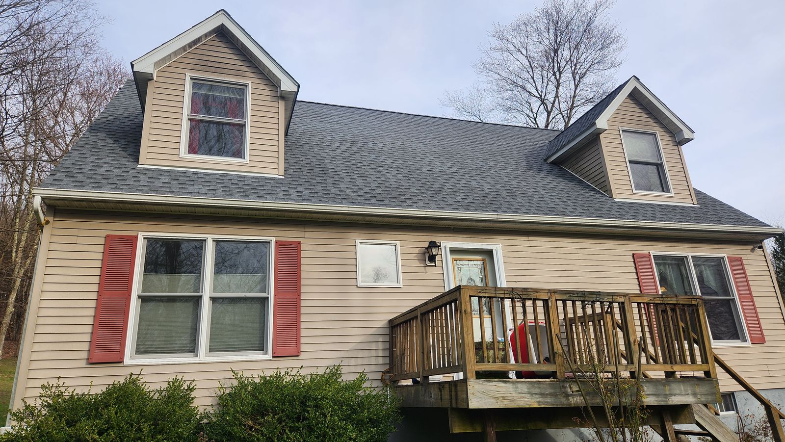 Cape style home with new architectural shingle roof and vinyl lap siding